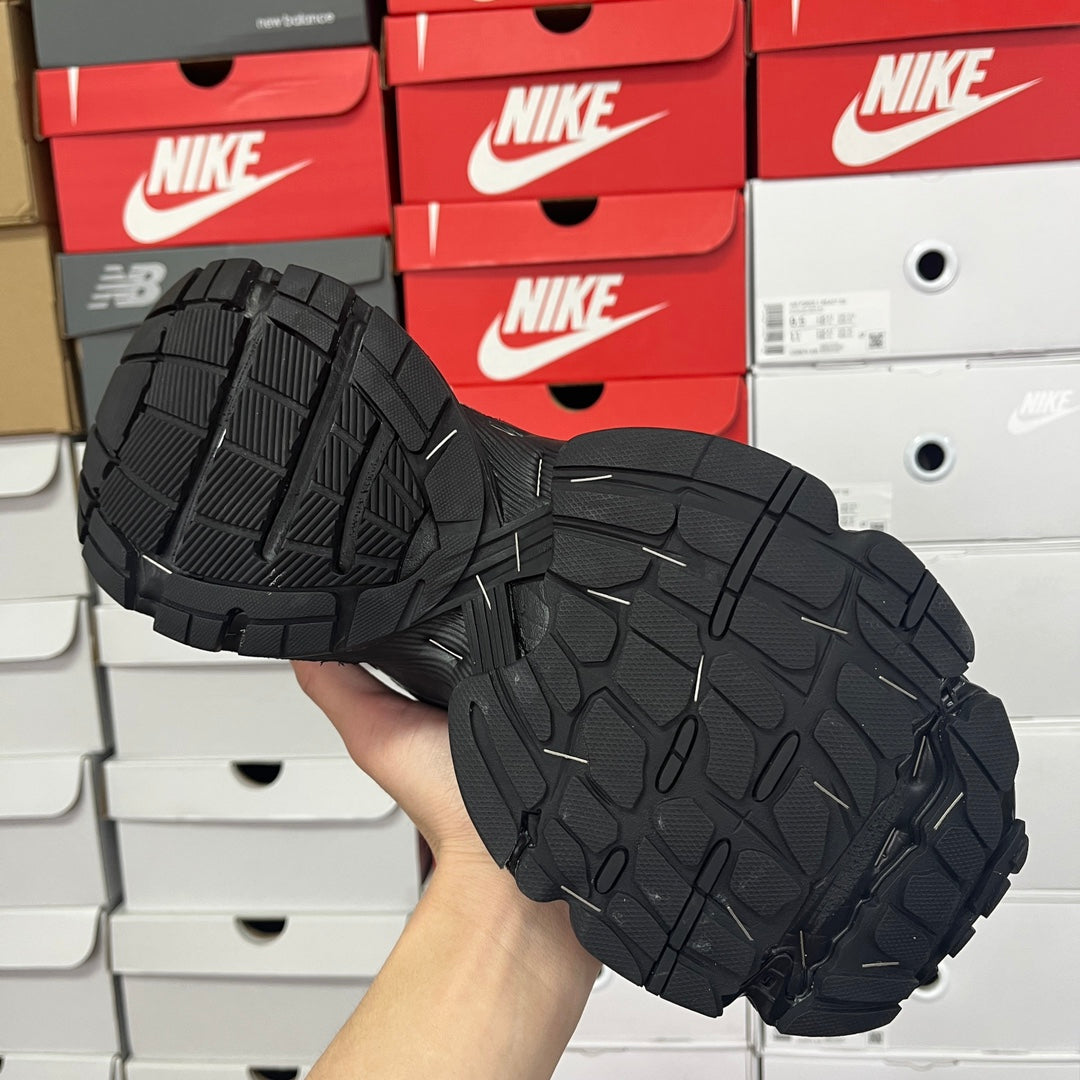 Balenciaga unisex running shoe outsole, black rubber tread pattern with flex grooves