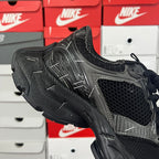 Balenciaga unisex running shoe, black mesh with gray stripe detailing and thick tread sole
