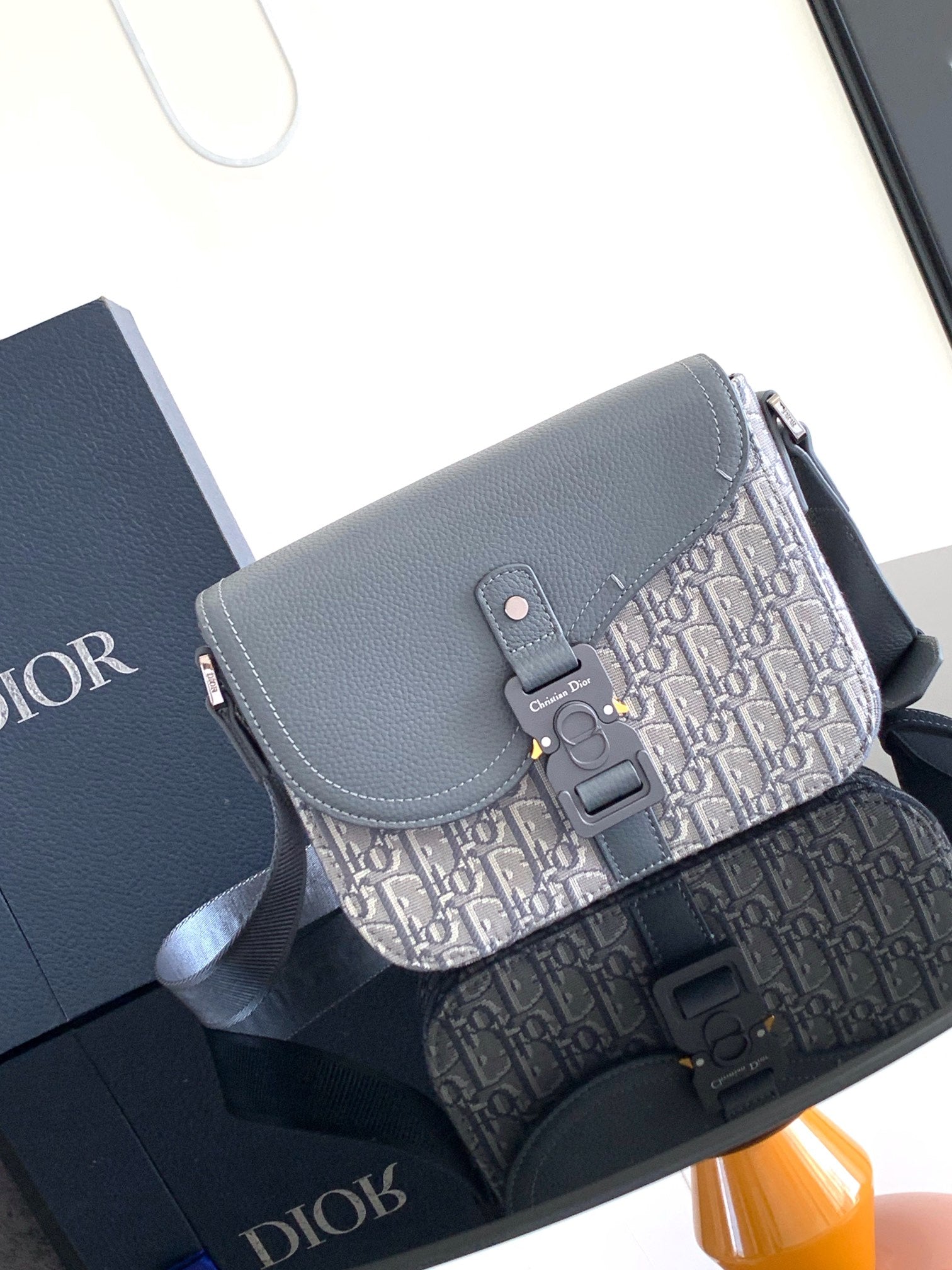 Dior crossbody bag with flap, gray leather and Dior Oblique canvas front panel.