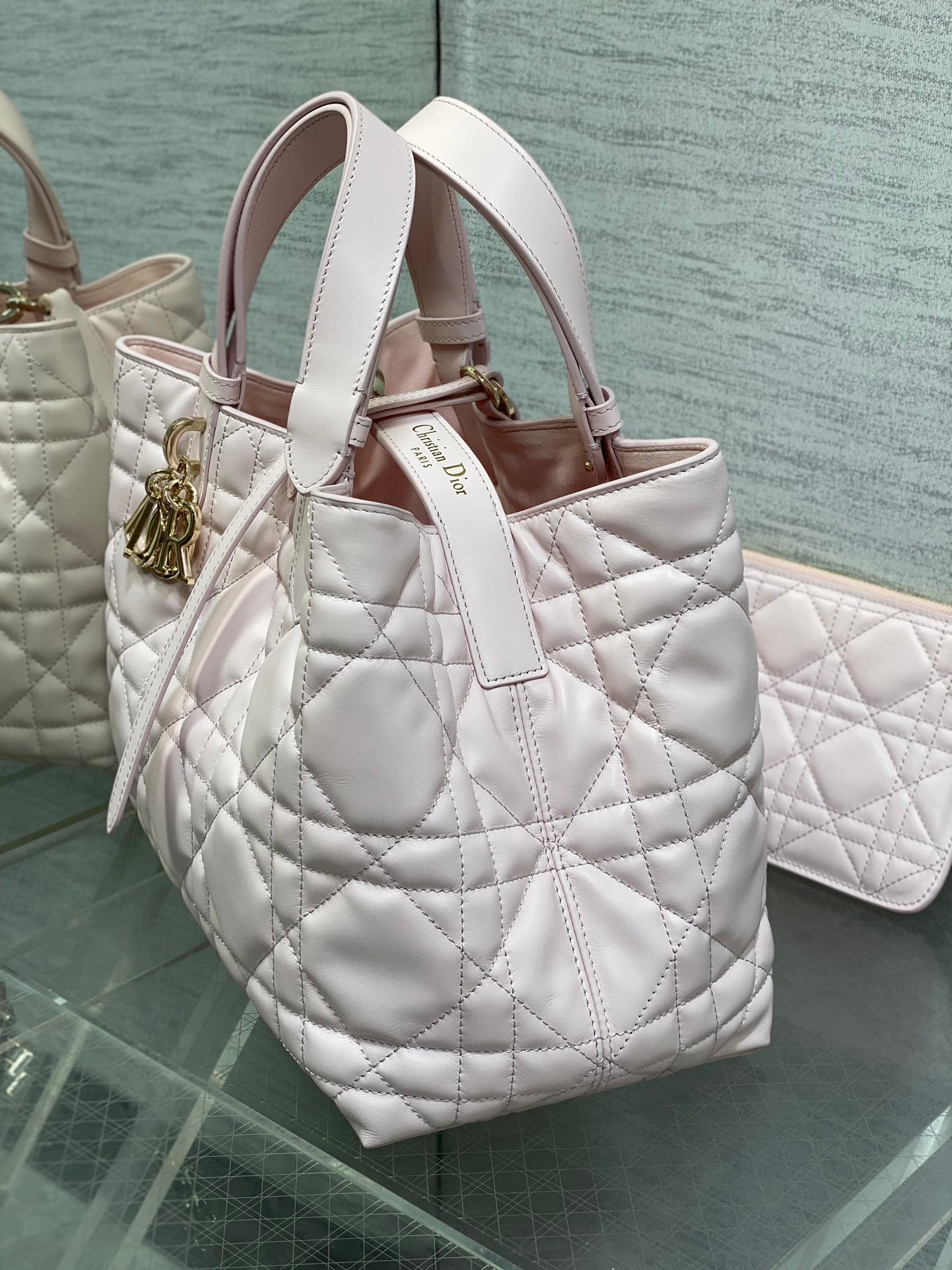 Dior handbag light pink quilted leather tote with top handles and gold accents
