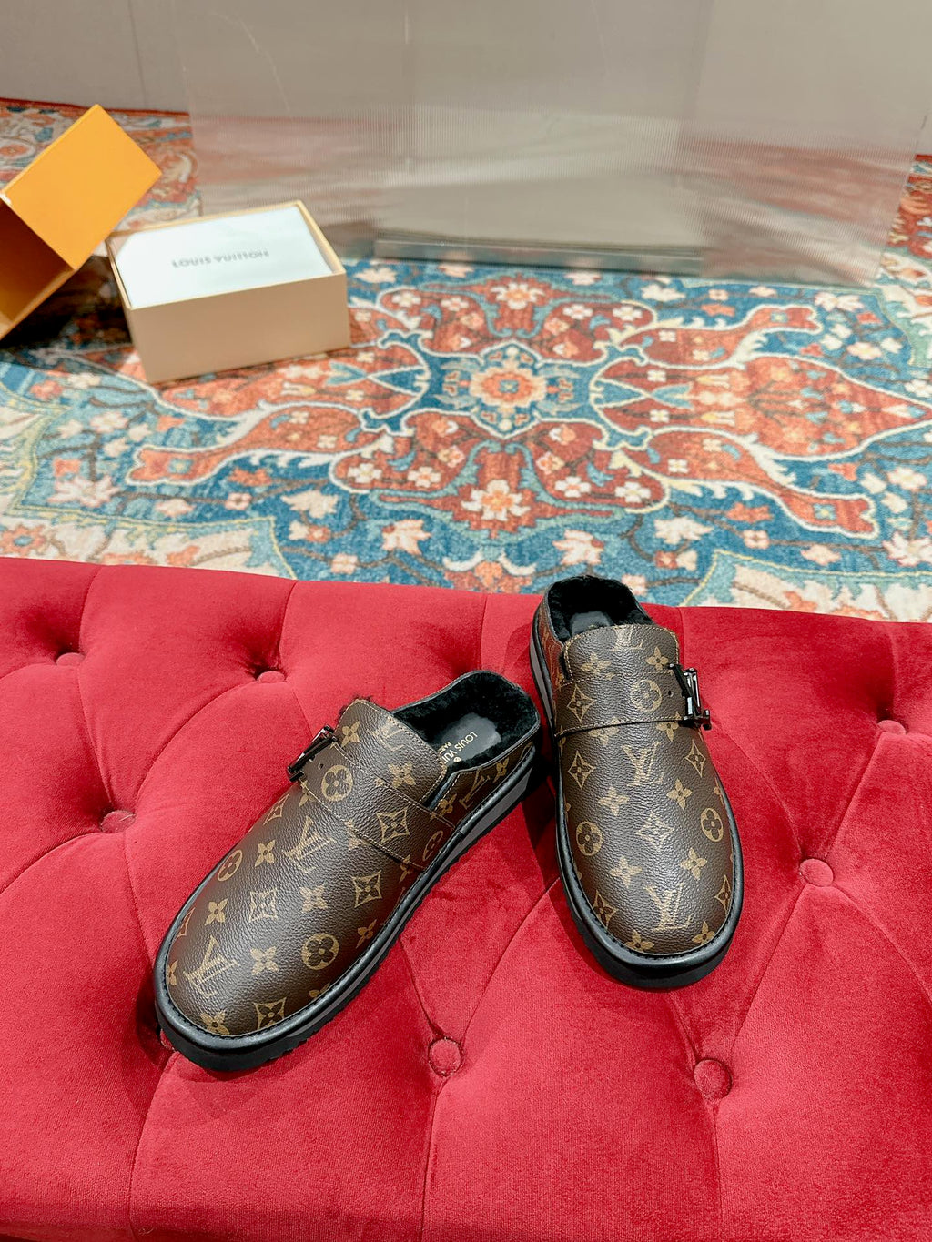 Louis Vuitton monogram slip-on sandals with black-lined interior