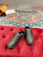 Louis Vuitton monogram slip-on sandals with black-lined interior