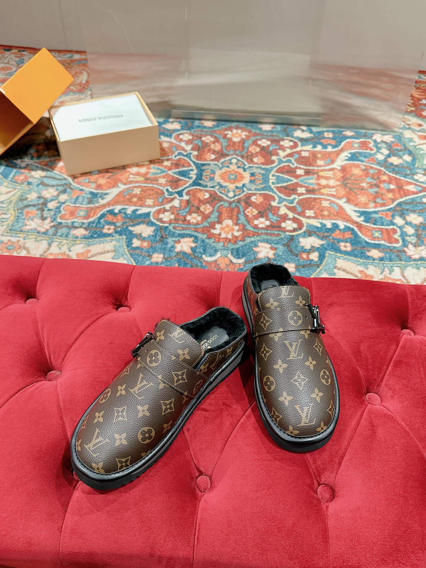 Louis Vuitton monogram slip-on sandals with black-lined interior