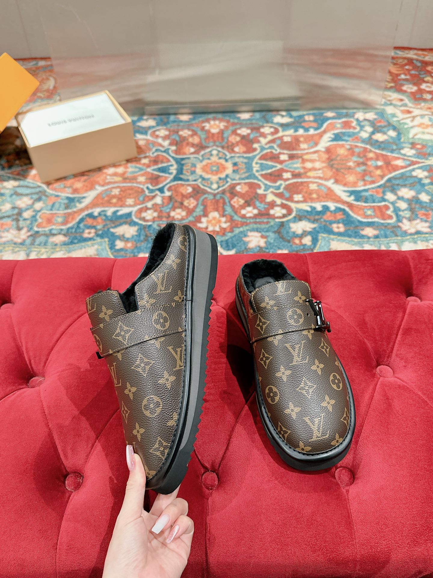 Louis Vuitton monogram slip-on sandals with black trim and sturdy outsole