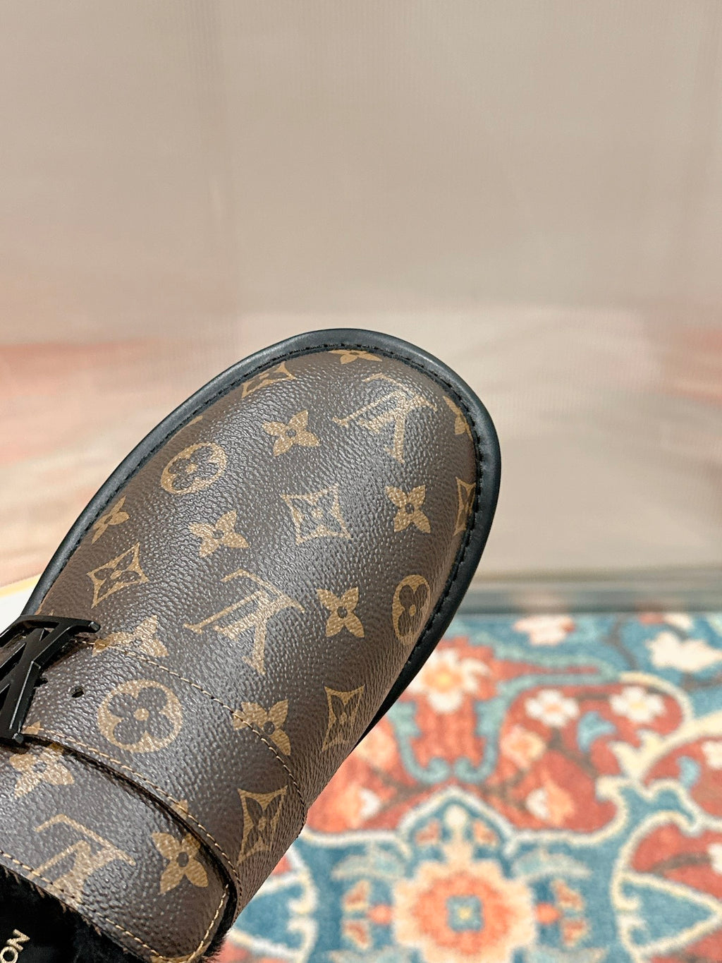Louis Vuitton monogram sandal toe cap with black trim and textured upper