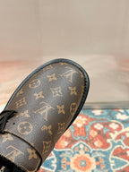 Louis Vuitton monogram sandal toe cap with black trim and textured upper