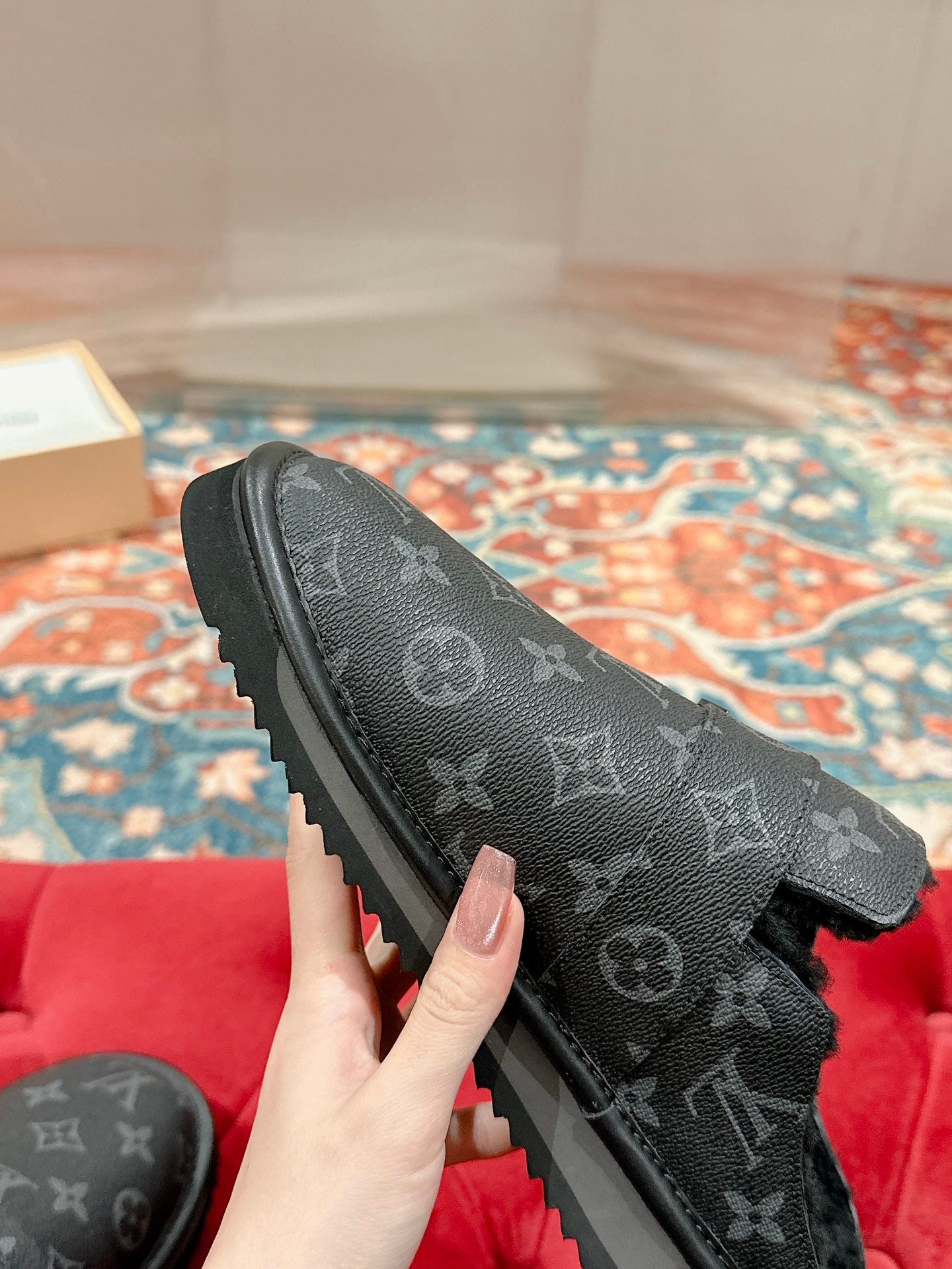 Black Louis Vuitton monogram slide sandal, close side view with buckle strap