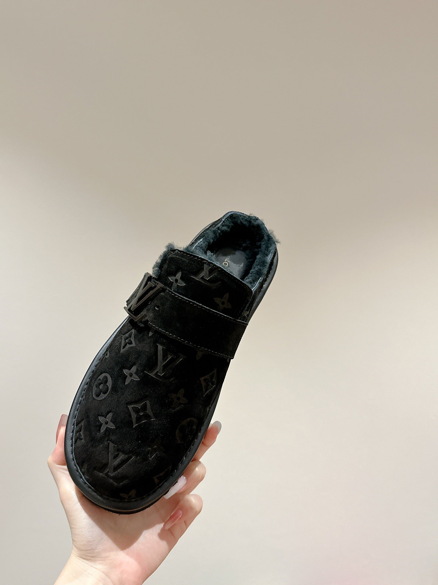 Black Louis Vuitton monogram sandal with wide strap and slip-on style