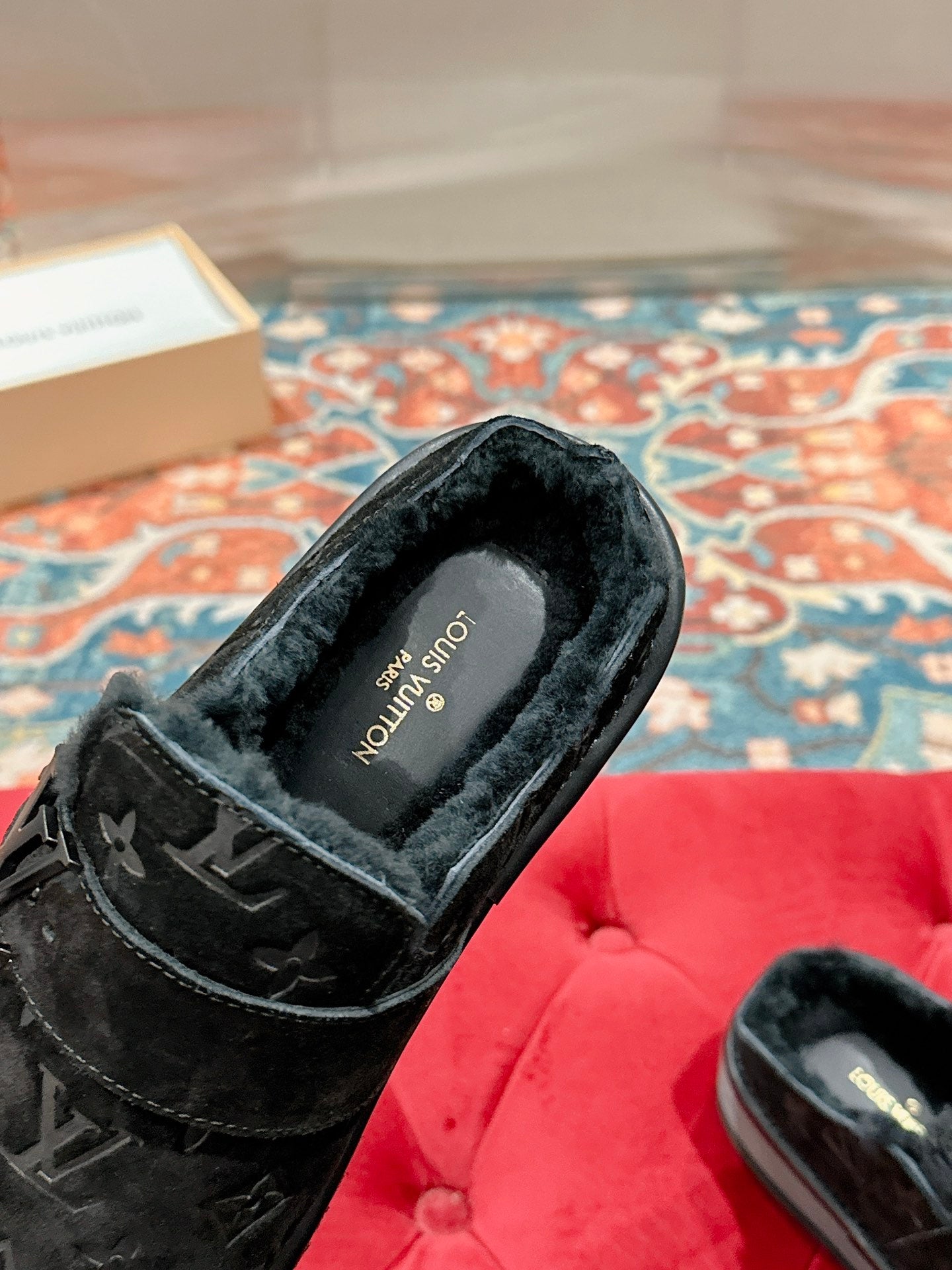 Black Louis Vuitton monogram slide sandal with plush interior lining