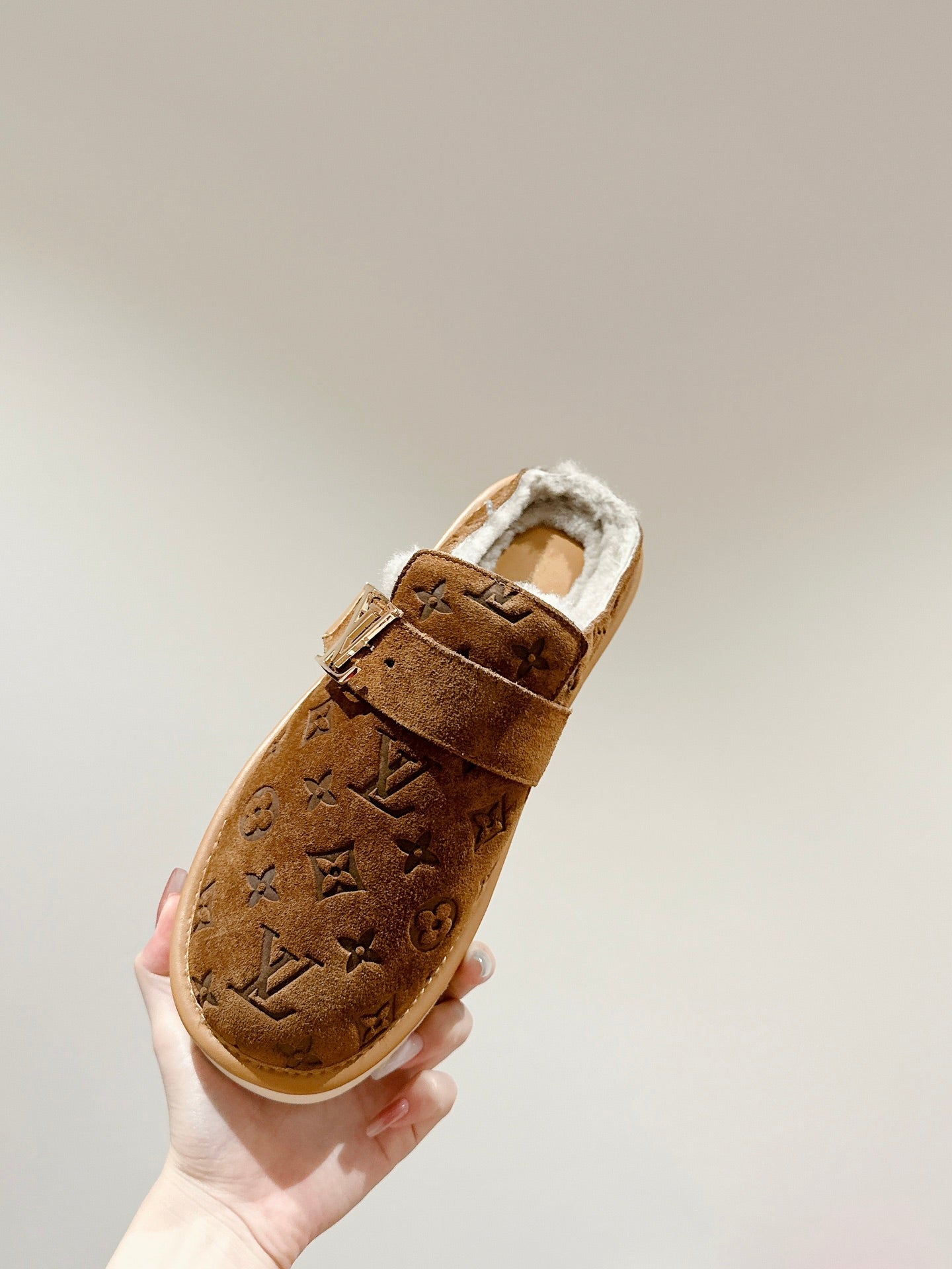 Louis Vuitton brown monogram suede slide sandal with white faux-fur lining