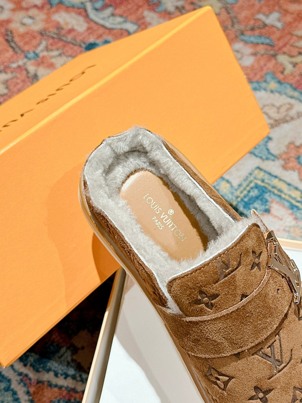 Louis Vuitton brown suede sandal with white shearling lining and side logo detail