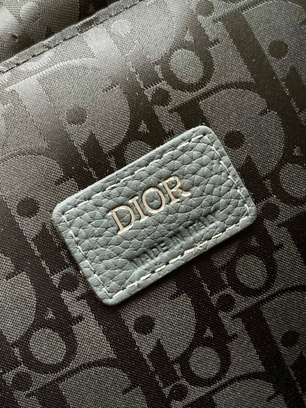 Gray monogram fabric pouch with DIOR logo patch