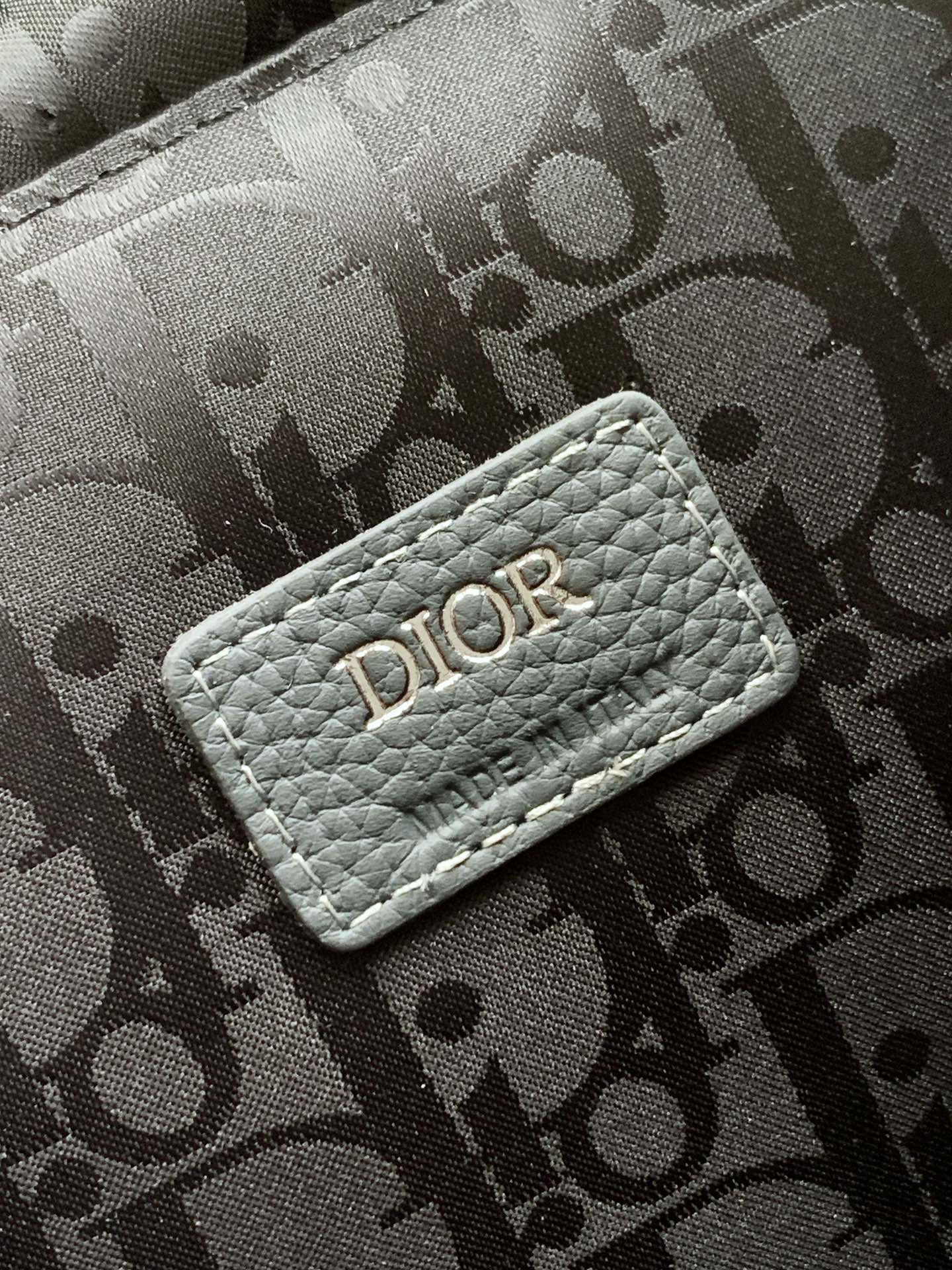Gray monogram fabric pouch with DIOR logo patch