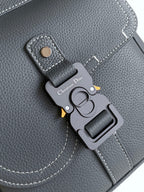Gray leather bag key charm with DIOR logo tag and metal clip