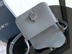 Dior small flap crossbody bag with front buckle detail and blue-gray leather