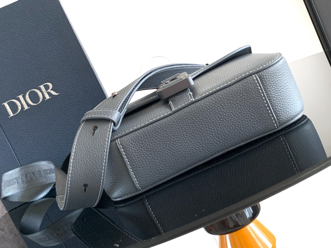 Dior leather shoulder bag with top handle, buckle closure, and blue-gray finish