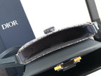Small Dior monogram bag with blue-gray leather frame and open black interior