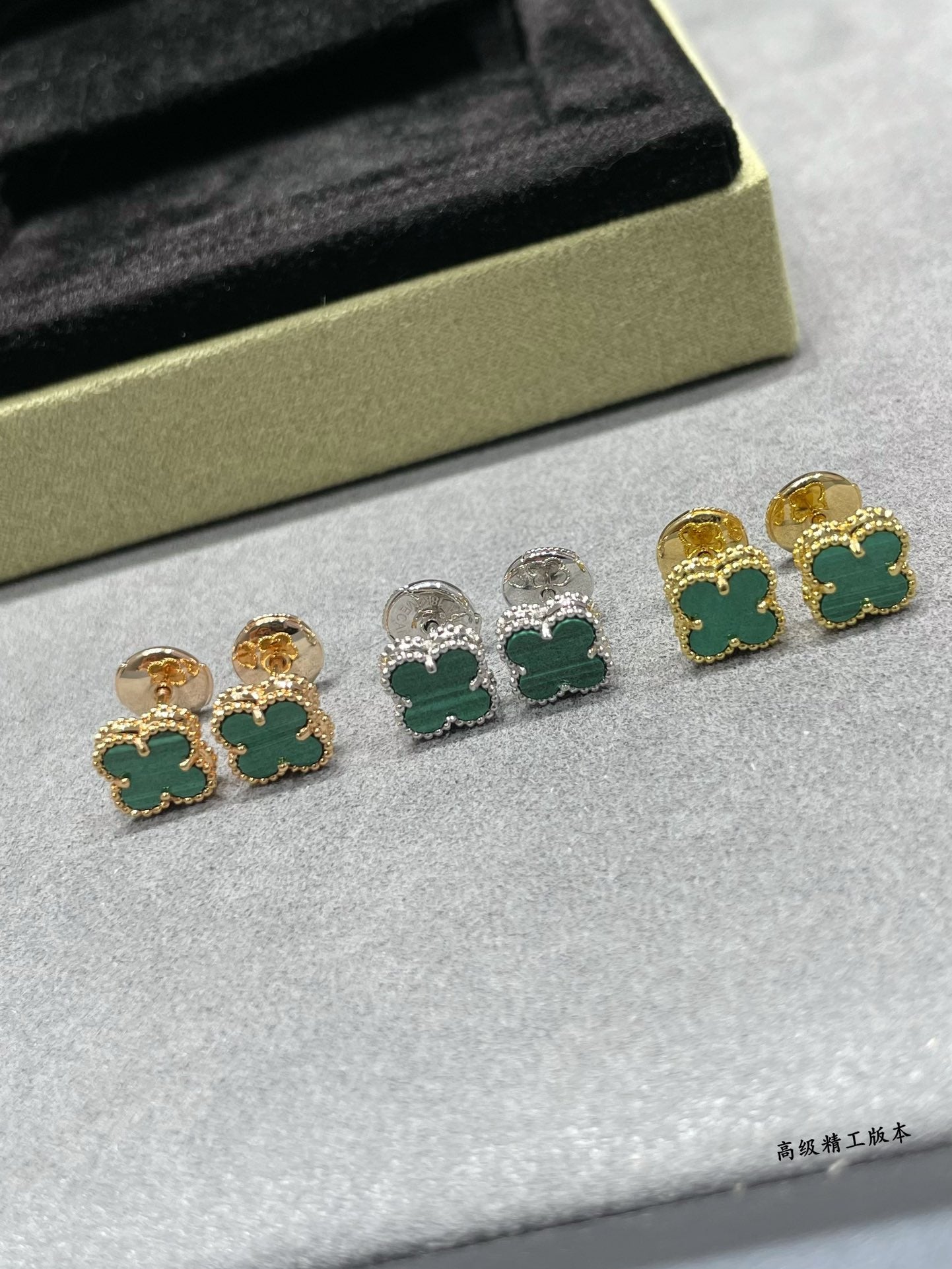 Van Cleef & Arpels clover stud earrings with green enamel, gold and silver tones