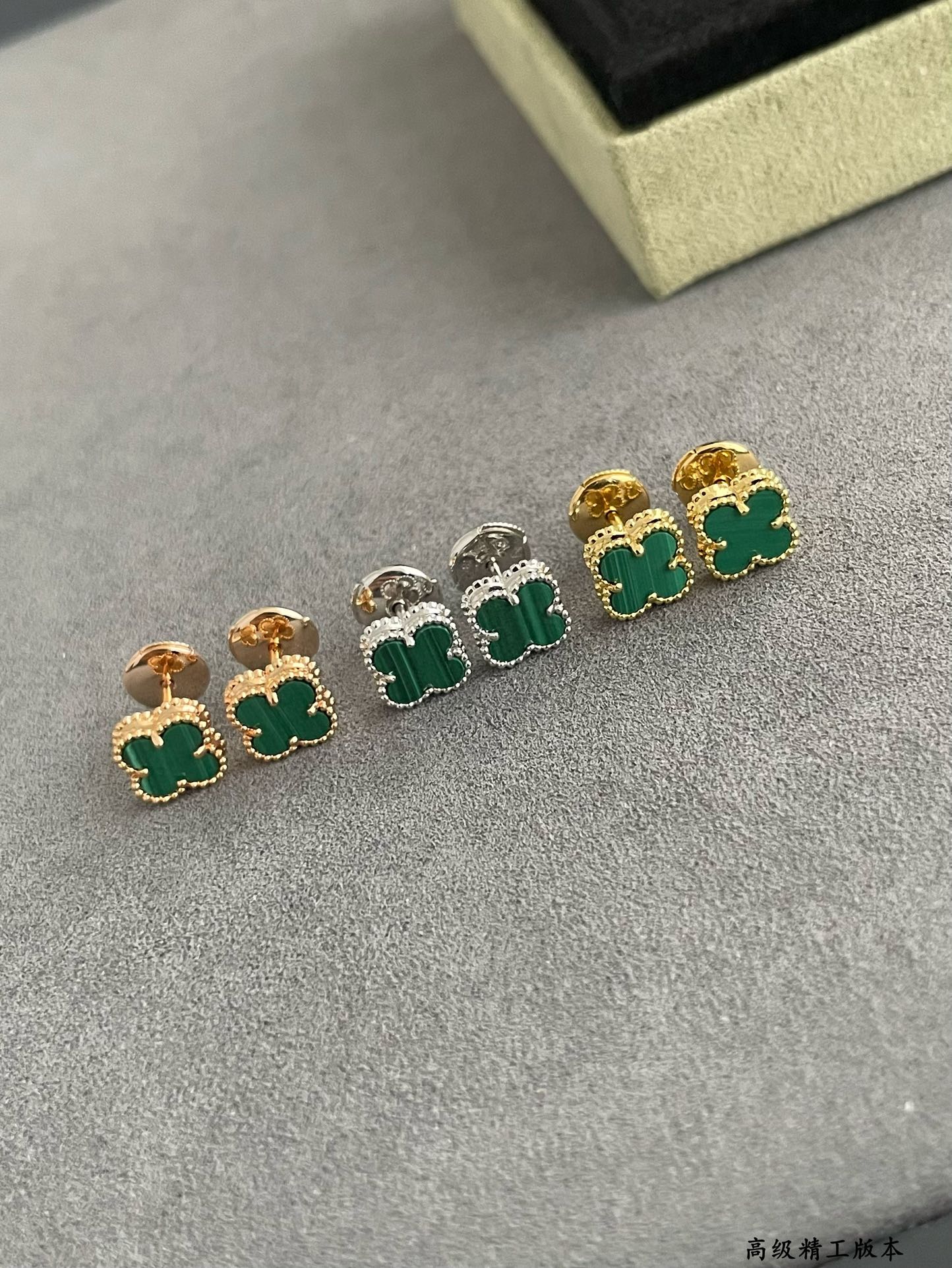 Van Cleef & Arpels clover stud earrings with green enamel, gold and silver pairs