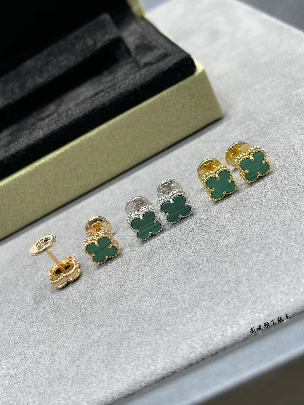 Van Cleef & Arpels clover stud earrings with green enamel, gold and silver tones