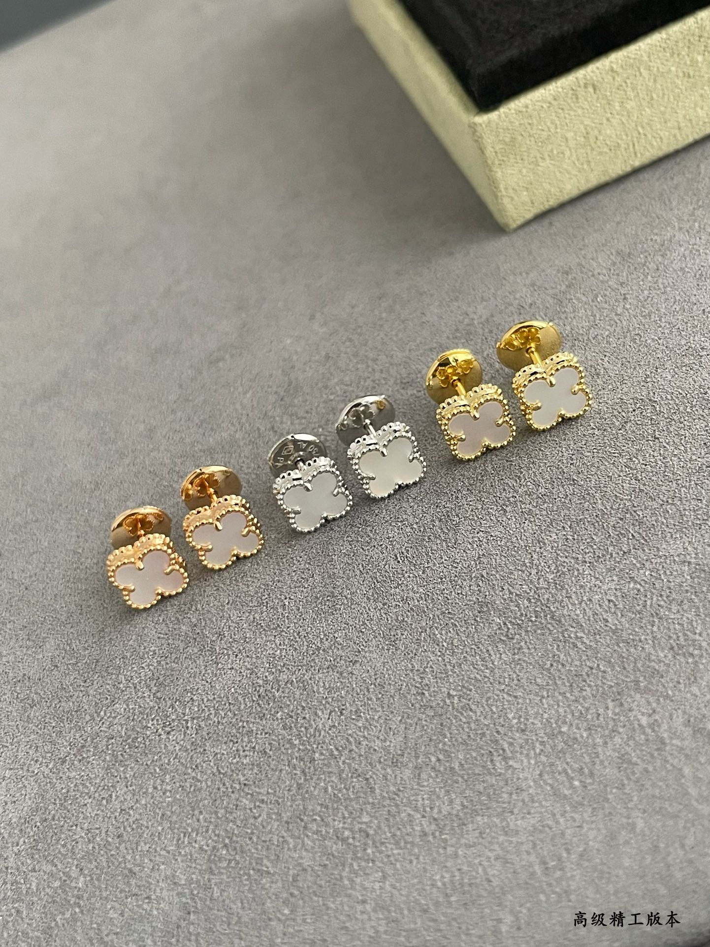 Clover stud earrings set with gold-tone and silver-tone studs, five-piece display