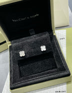 Silver-tone clover stud earrings in black velvet presentation box