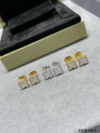 Four-piece clover stud earrings set in gold-tone and silver-tone
