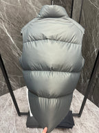 Light gray quilted puffer vest back view with hooded collar and full-length zipper