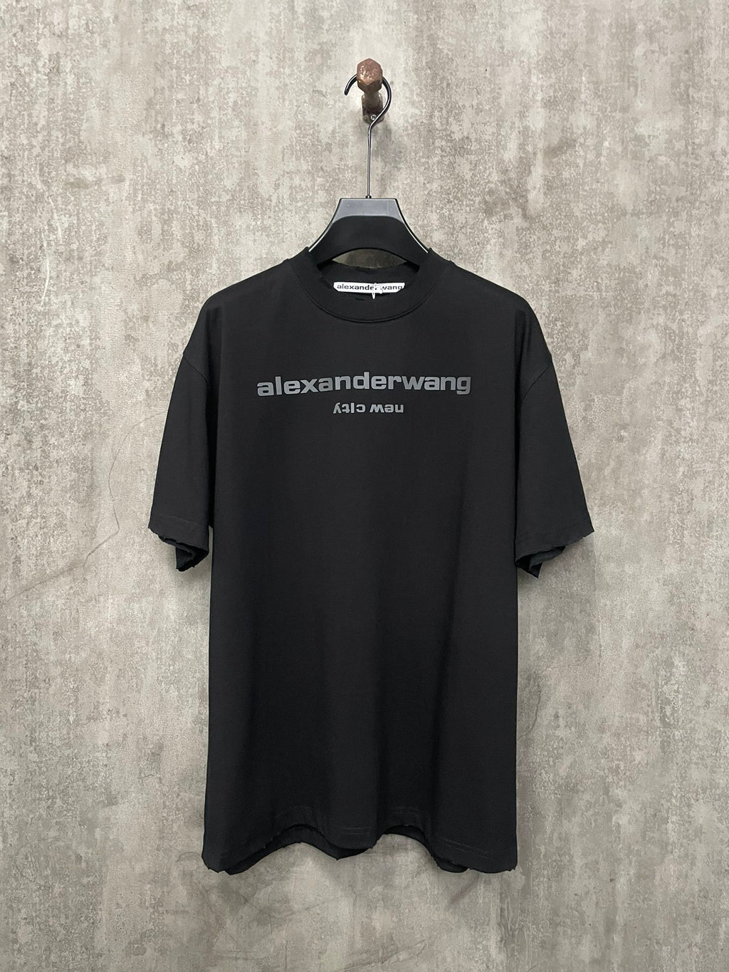 Black short-sleeve T-shirt with front crew neck and chest logo print