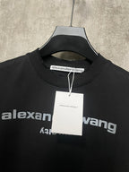 Black short-sleeve T-shirt neckline with hang tag and partial logo