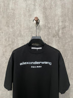 Black short-sleeve T-shirt with crew neck and front logo print close-up
