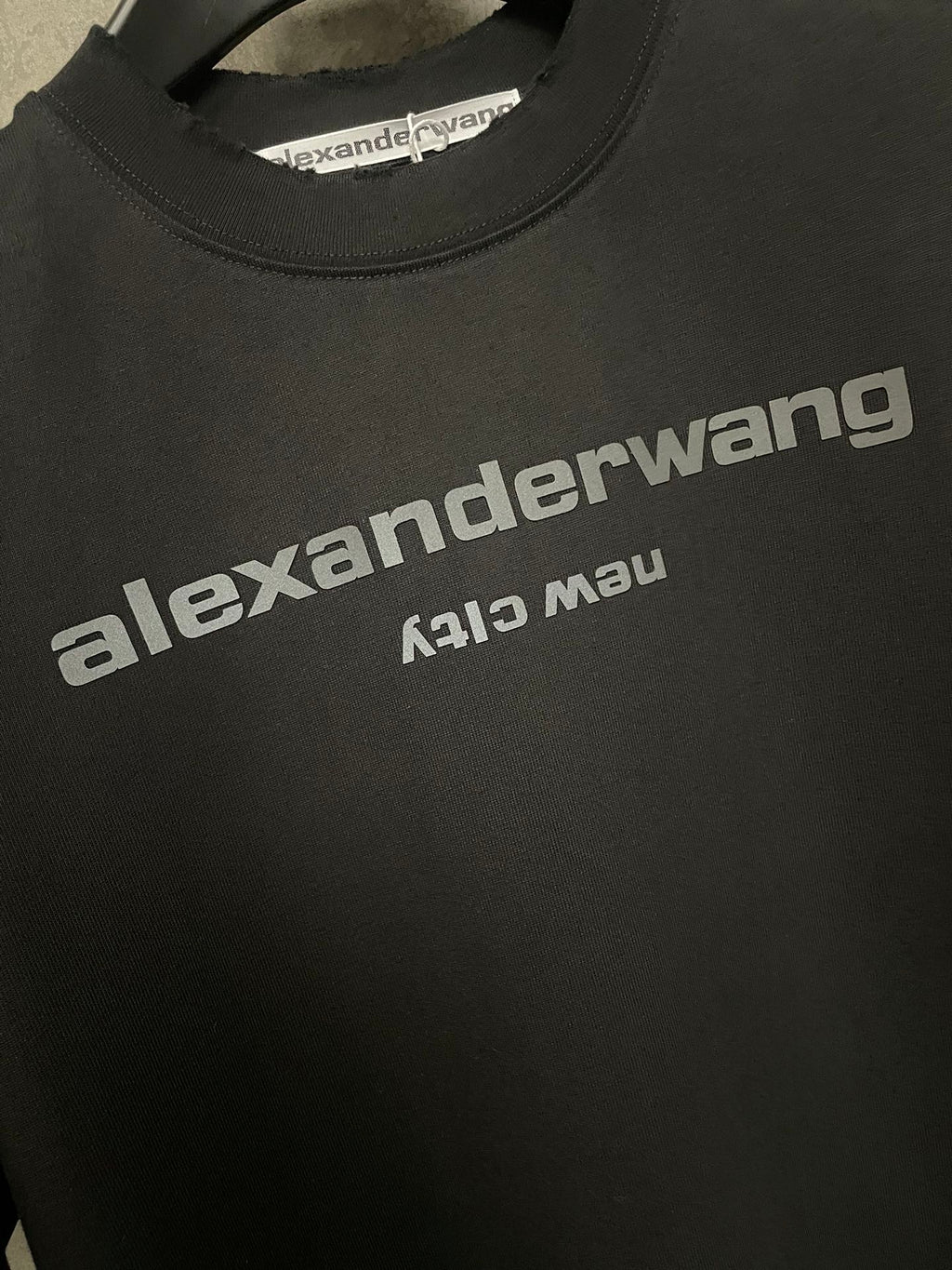 Black T-shirt logo print on chest with crew neck collar