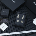 Chanel accessory set: four CC stud earrings with faux pearls and crystal outlines