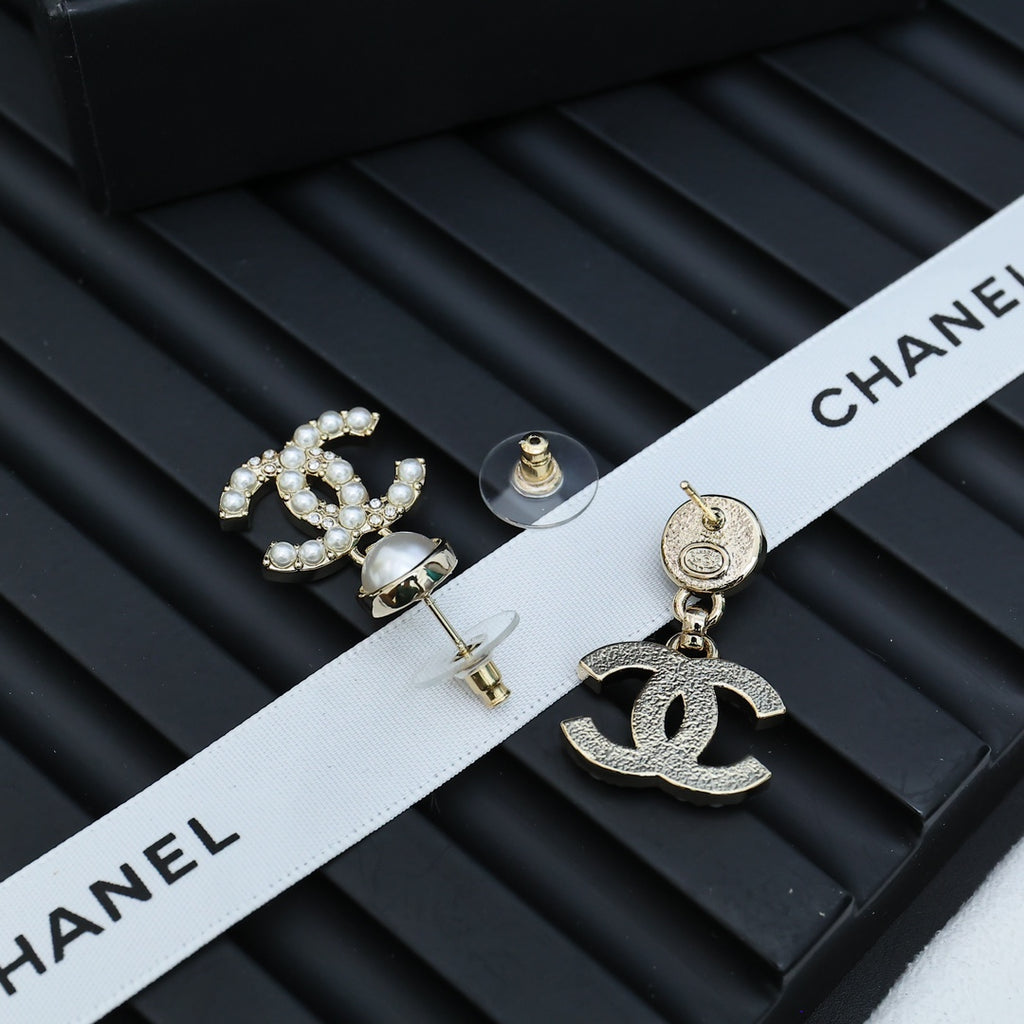 Chanel accessory: pearl-topped CC earrings with crystal border and gold-tone hooks