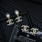 Chanel accessory: pearl and crystal CC drop earrings with gold-tone charms