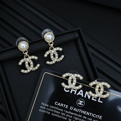 Chanel accessory: pearl and crystal CC drop earrings with gold-tone charms