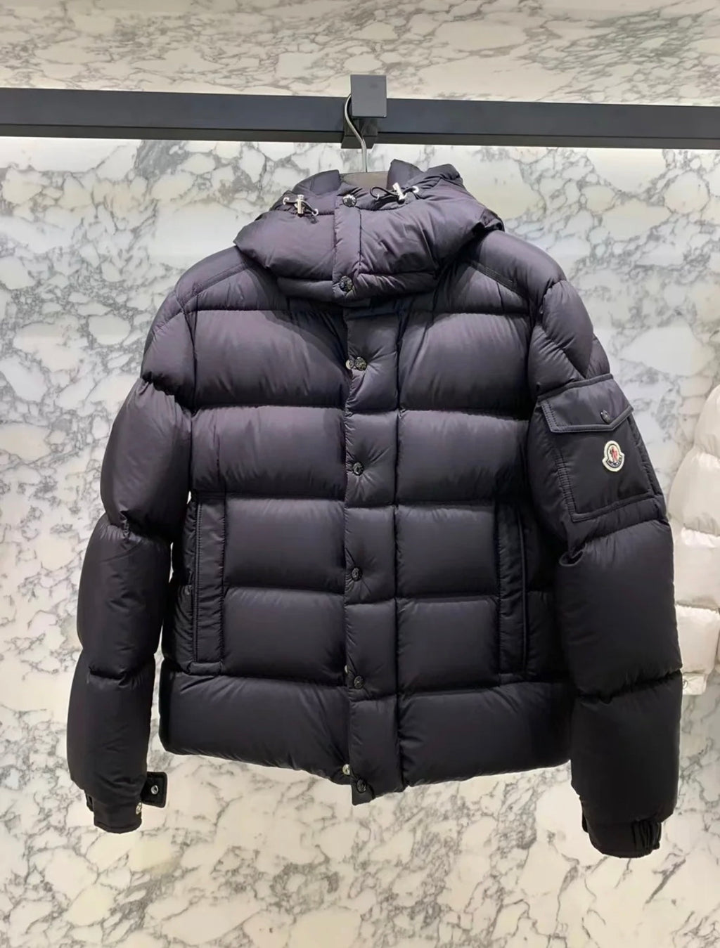 Long puffer jacket in dark color, quilted puffer with hood and side patch pocket