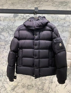 Long puffer jacket in dark color, quilted puffer with hood and side patch pocket