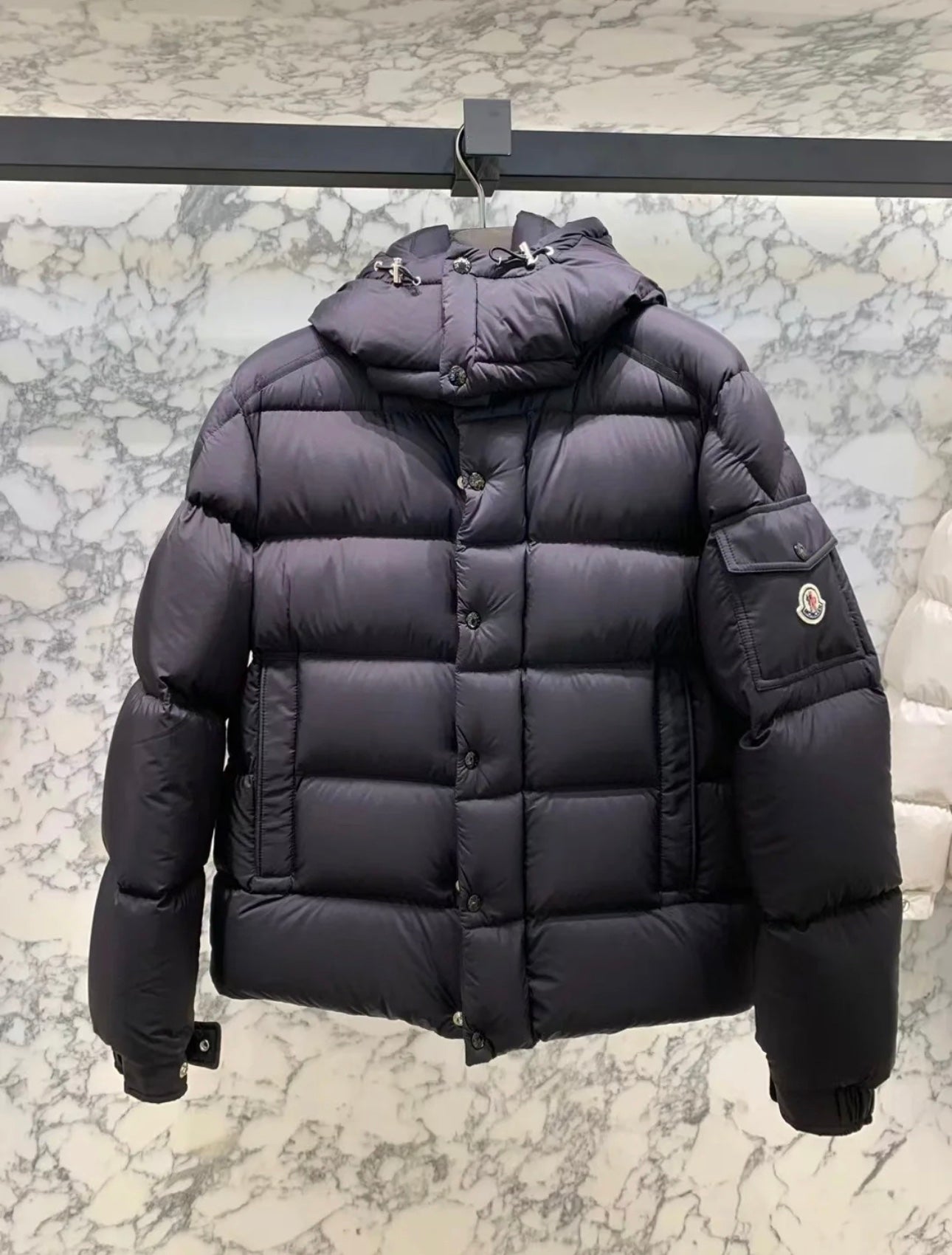 Long puffer jacket in dark color, quilted puffer with hood and side patch pocket