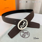 Brown leather belt with silver oval buckle on a diagonal angle
