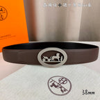 Brown leather belt with silver oval buckle featuring a horse rider emblem