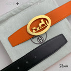 Hermes belt set, orange and black leather straps with large gold and silver buckles
