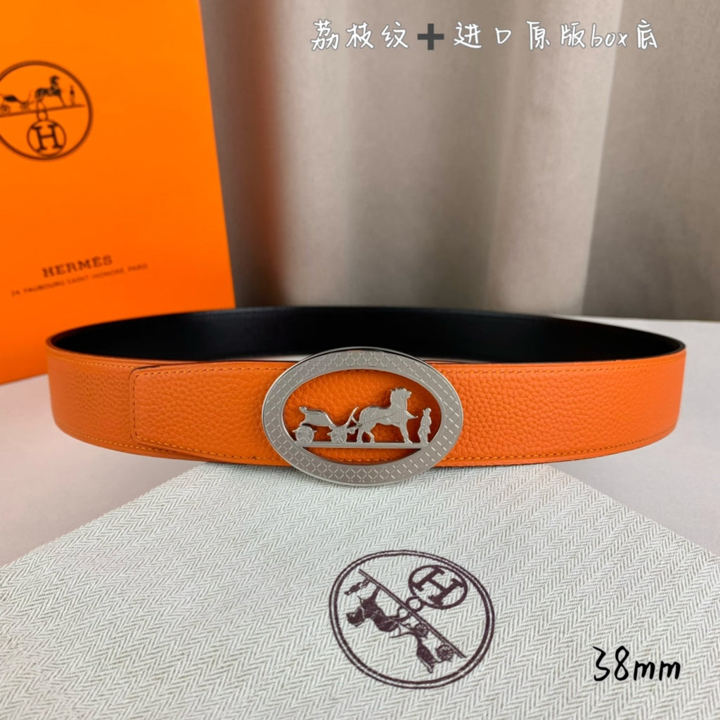 Hermes belt, orange leather with centered silver oval logo buckle on the strap