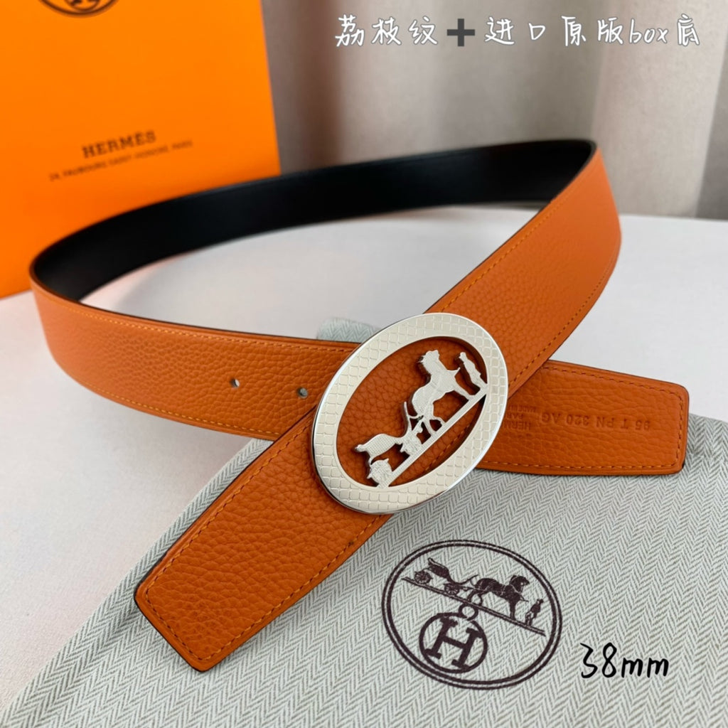 Hermes belt, orange leather with silver oval logo buckle and matching keeper loop