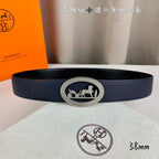 Leather belt with navy strap and silver oval horse buckle