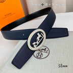 Leather belt with navy strap and silver oval horse buckle, folded view