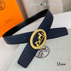 Leather belt with navy strap and gold oval horse buckle, folded view