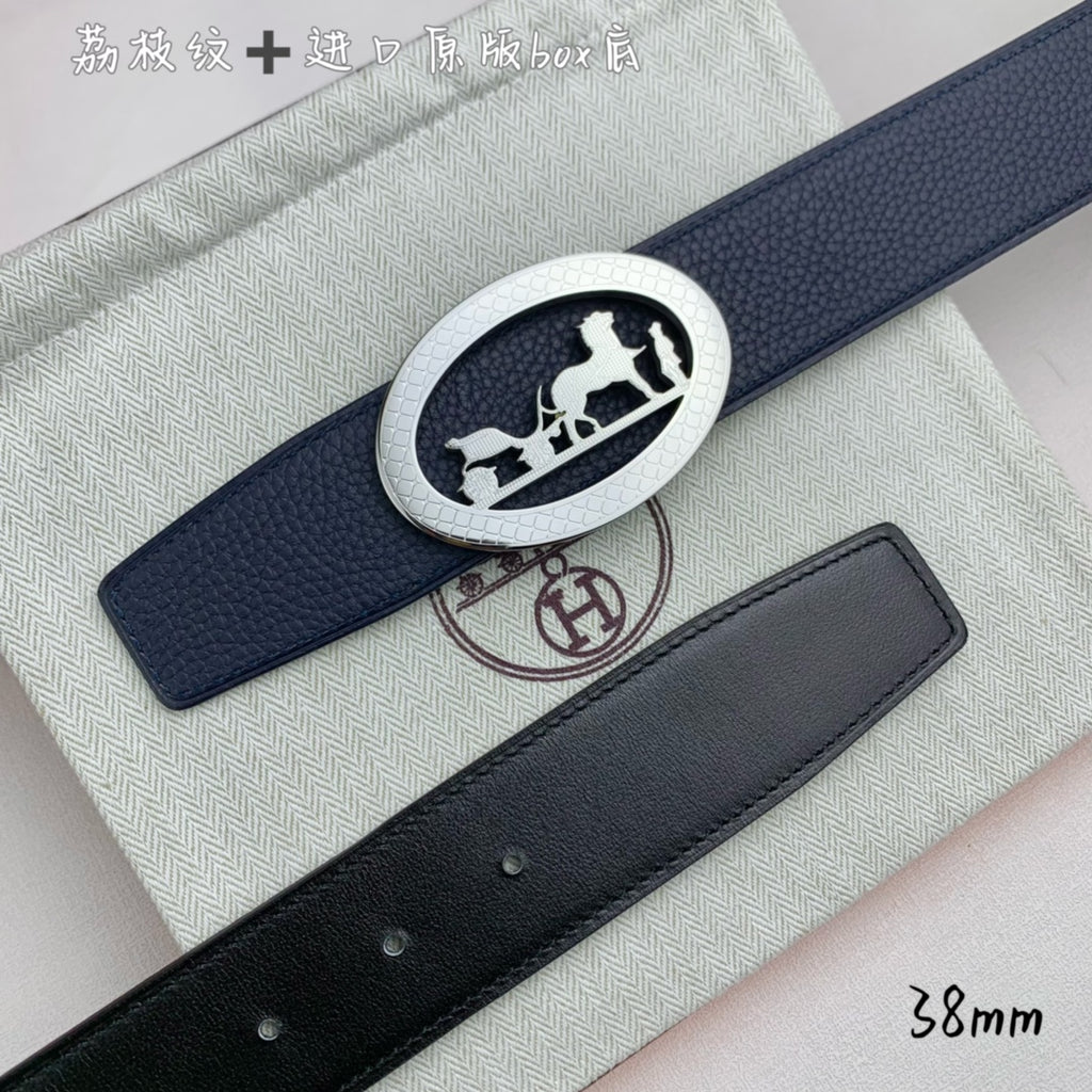 Leather belt with navy strap and silver oval horse buckle, close-up