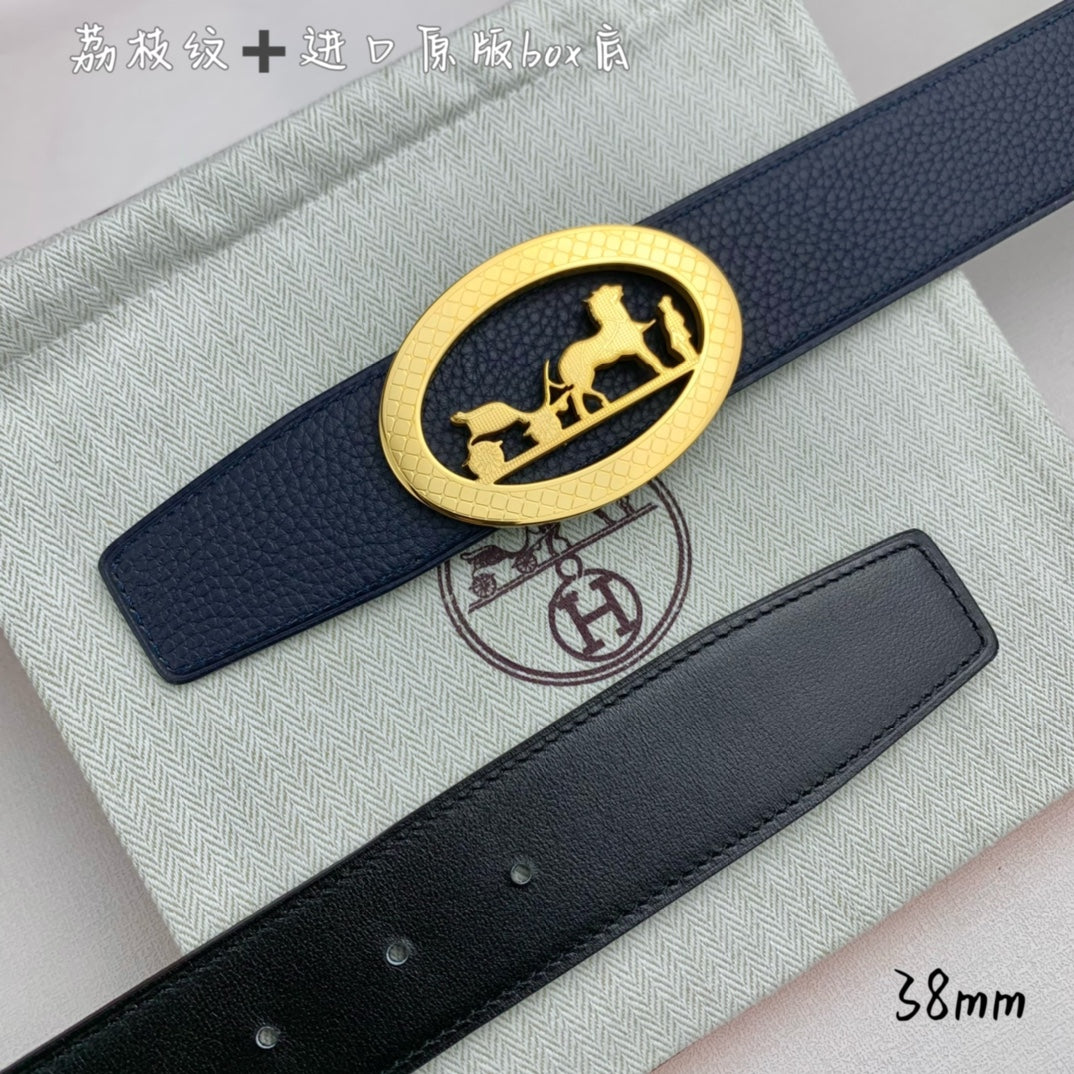 Leather belt with navy strap and gold oval horse buckle, close-up