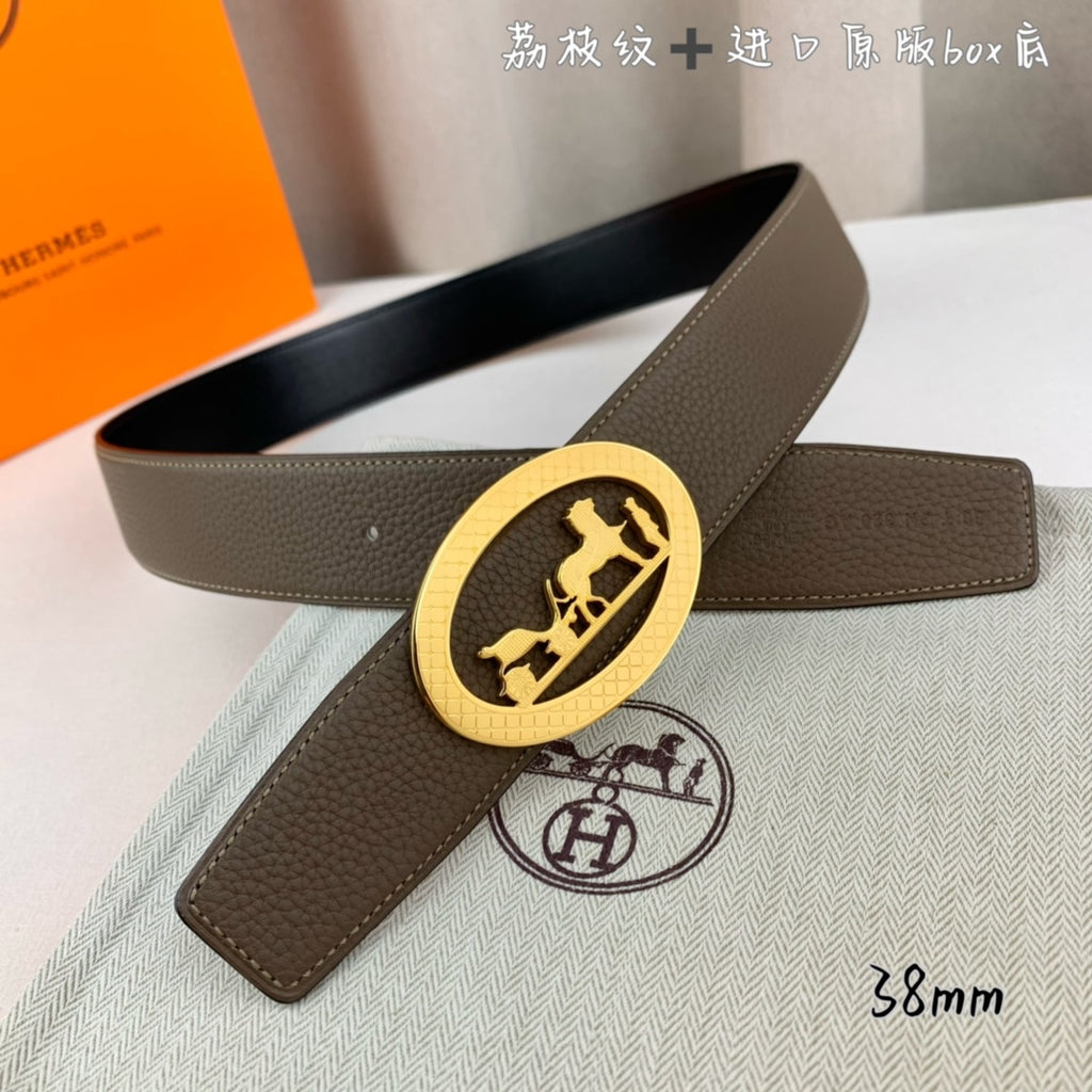 Hermes leather belt with taupe strap and gold oval buckle, black belt nearby